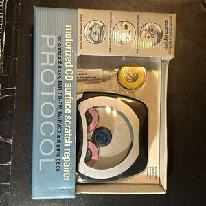 Protocol motorized CD surface scratch repairer